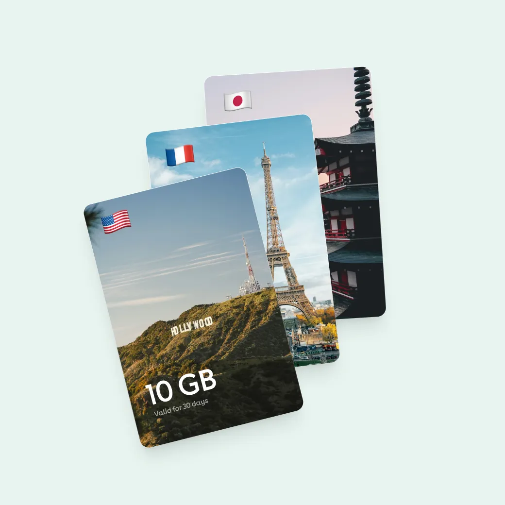 Destination eSIM cards for the United States, France and Japan, fanned out