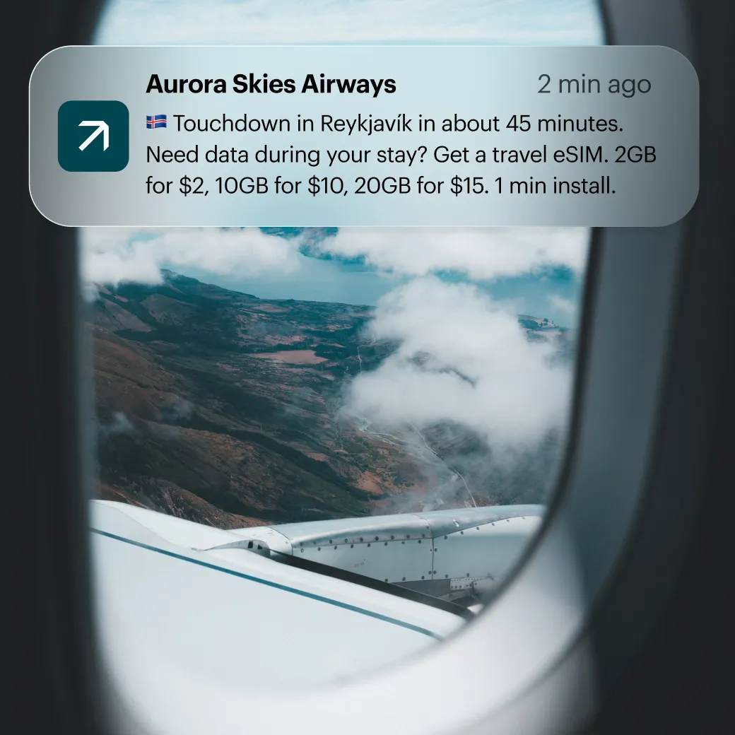 An airline notifying a passenger before landing, offering a travel eSIM for their stay